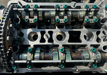Load image into Gallery viewer, 2.8 cylinder heads rebuilt with upgraded exhaust valves/ guides with new cam chain tensioners assembled for 2.7 application