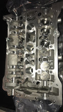 Load image into Gallery viewer, 2.8 cylinder heads rebuilt with upgraded exhaust valves/ guides with new cam chain tensioners assembled for 2.7 application