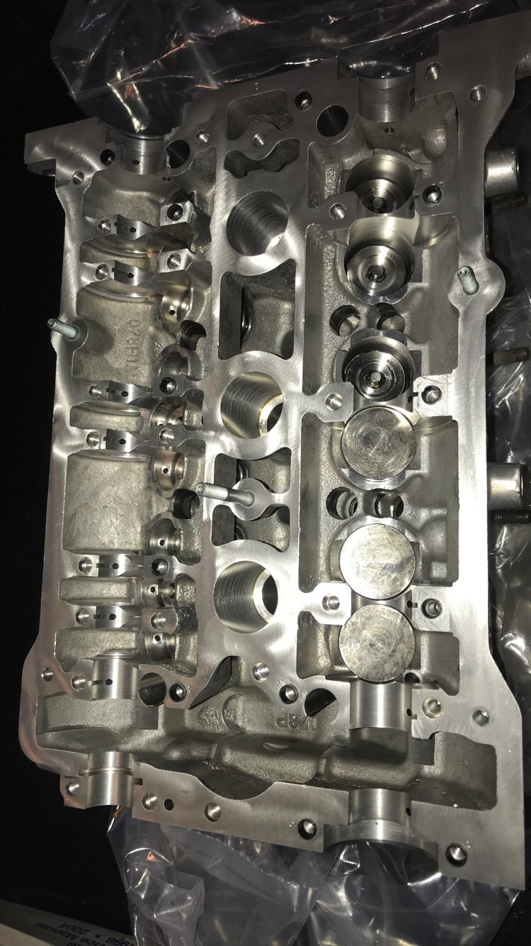 2.8 cylinder heads rebuilt with upgraded exhaust valves/ guides with new cam chain tensioners assembled for 2.7 application